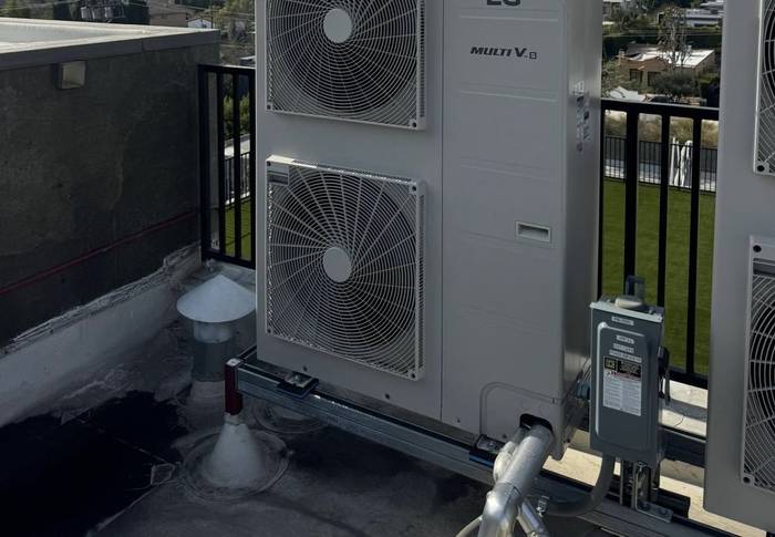 LG Multi V VRF condensing units on a rooftop rail on an Oahu commercial building.