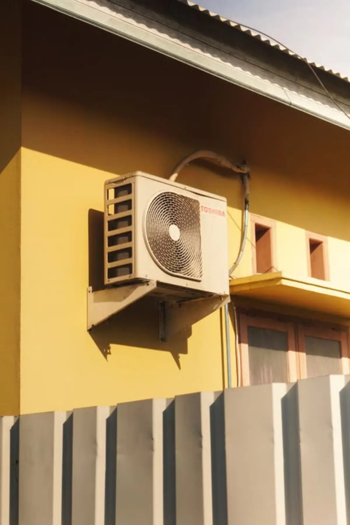 Wall-mounted exterior fan unit.